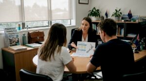 Couple consulting adviser on home loan options