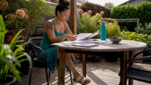Woman reviewing mortgage documents at home