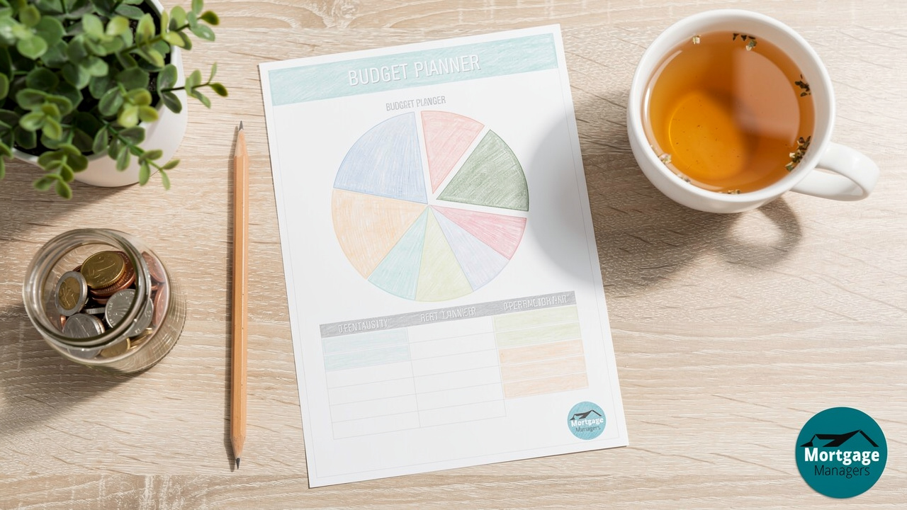 Budget planner and savings jar on a clean desk